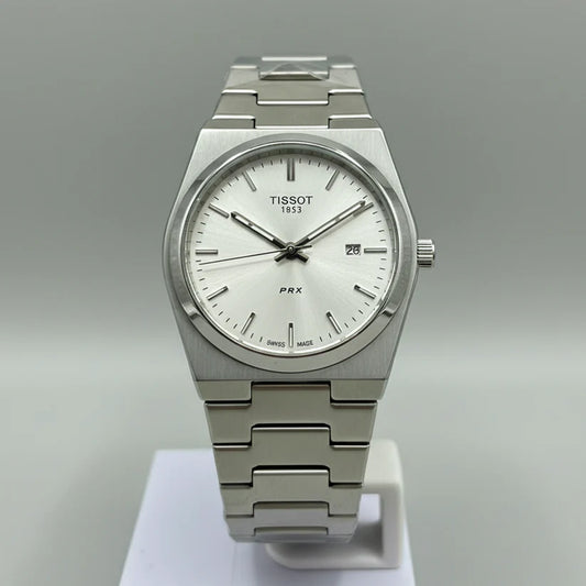 Front view of Tissot PRX 35mm Watch – Silver Edition, Plain White Dial